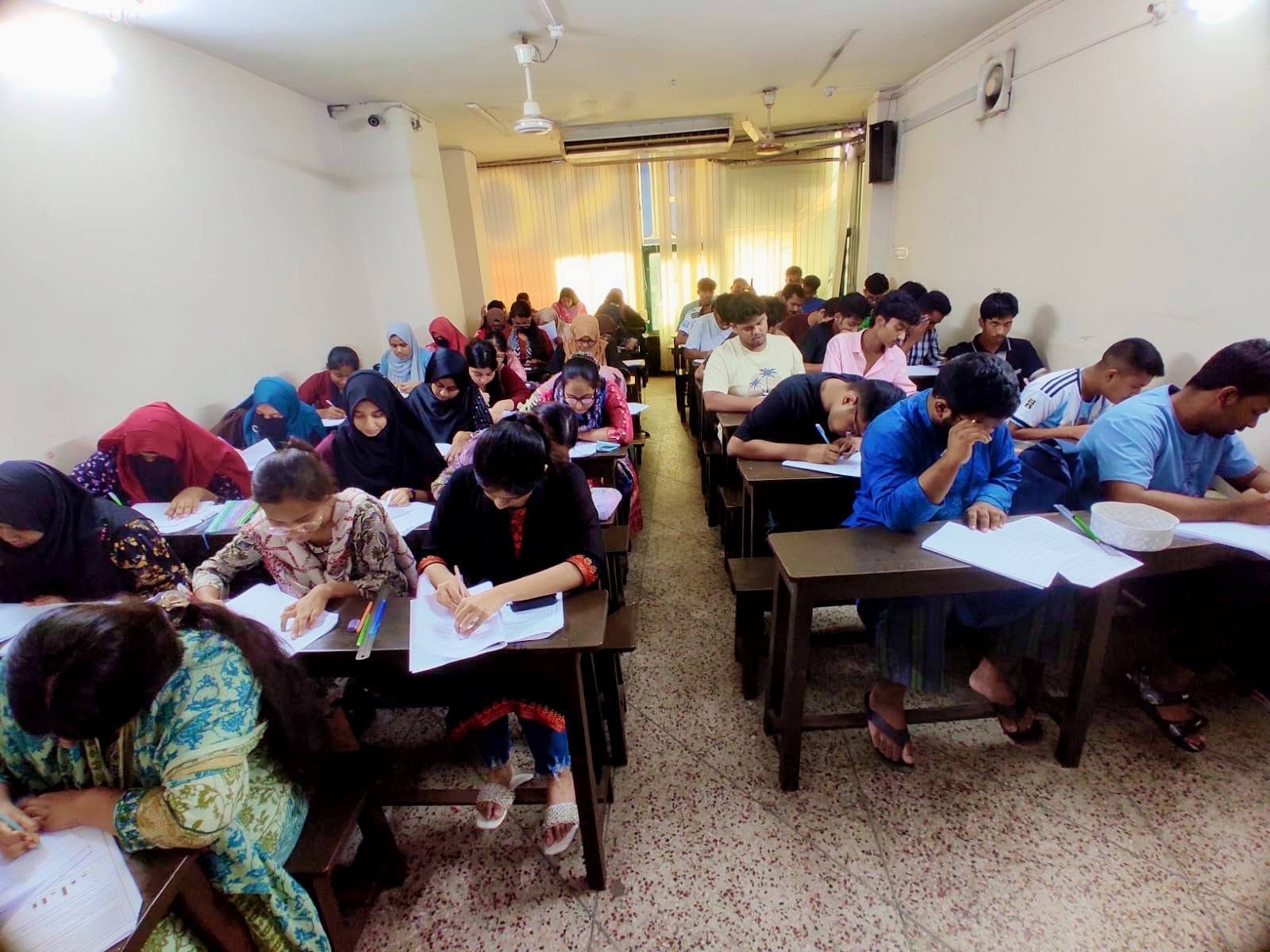 Students learning at UCC Mirpur coaching center